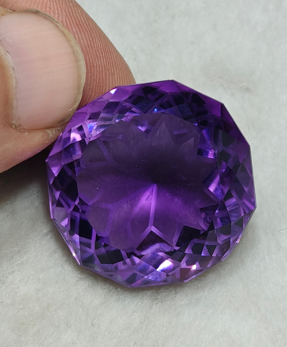 An amazing faceted fancy cut amethyst gemstone 77 carats