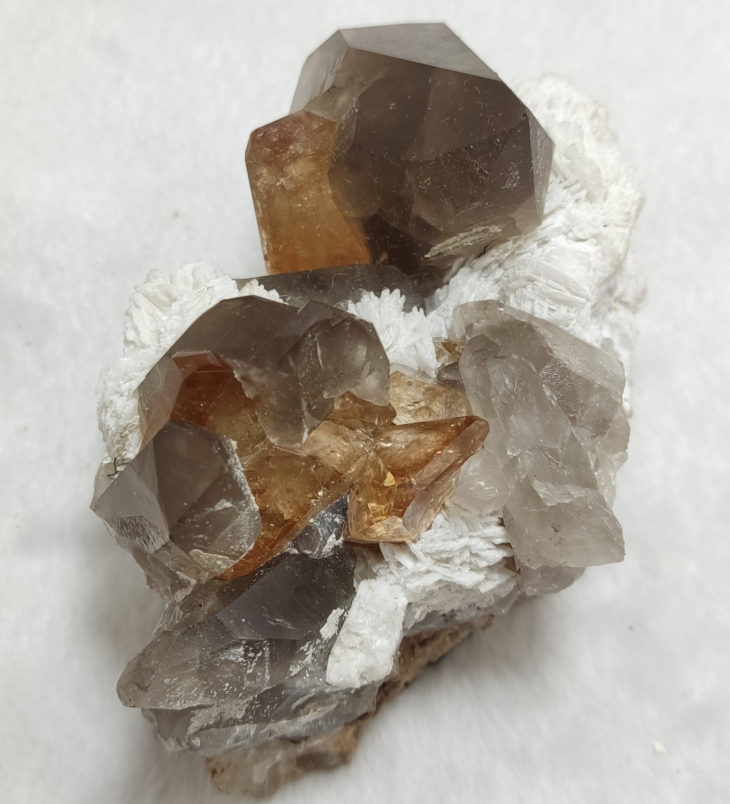 An amazing Specimen of terminated peach color Topaz crystals on matrix 455 grams