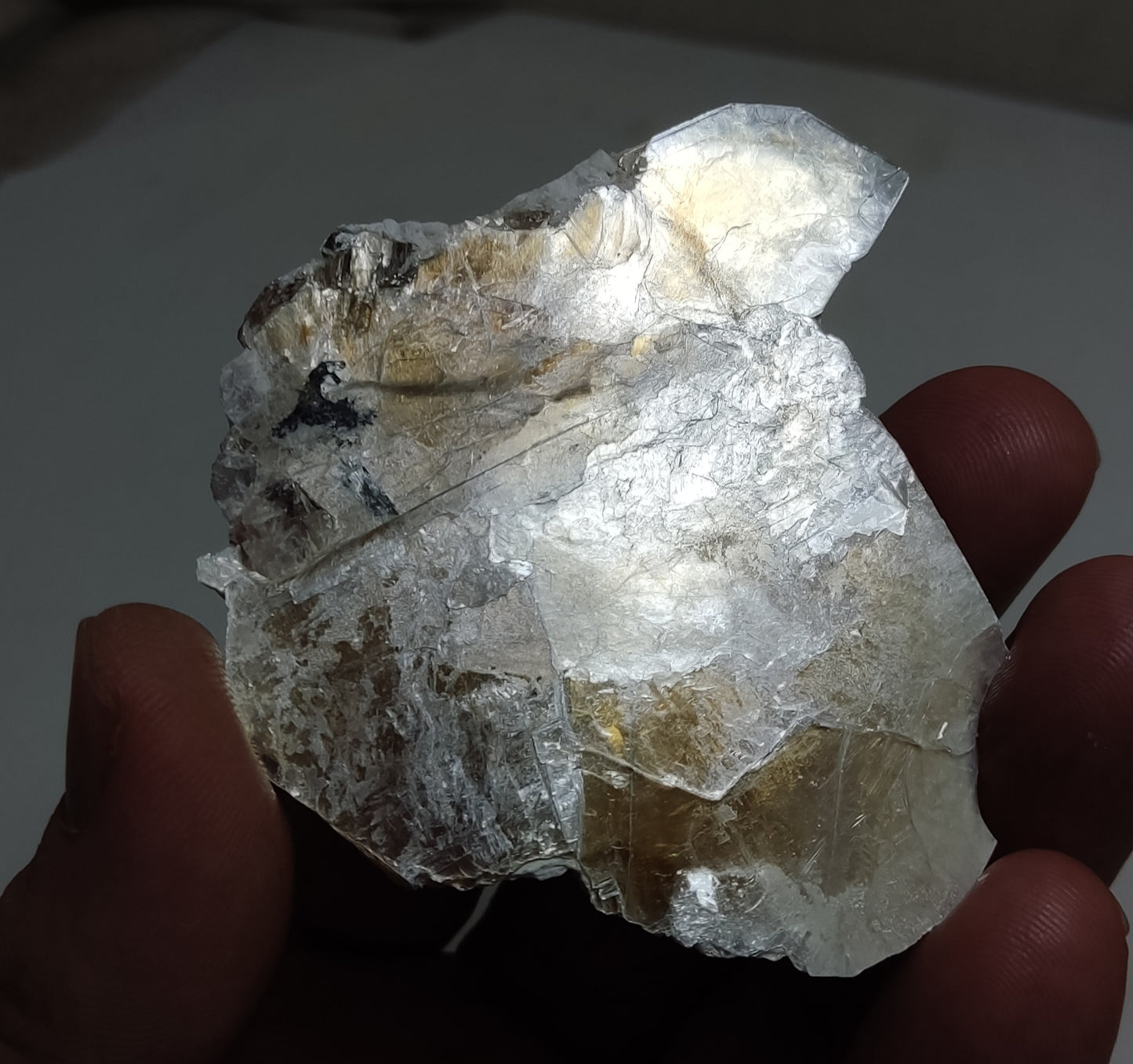 An amazing Specimen of terminated peach color Topaz crystal embedded in muscovite 48 grams