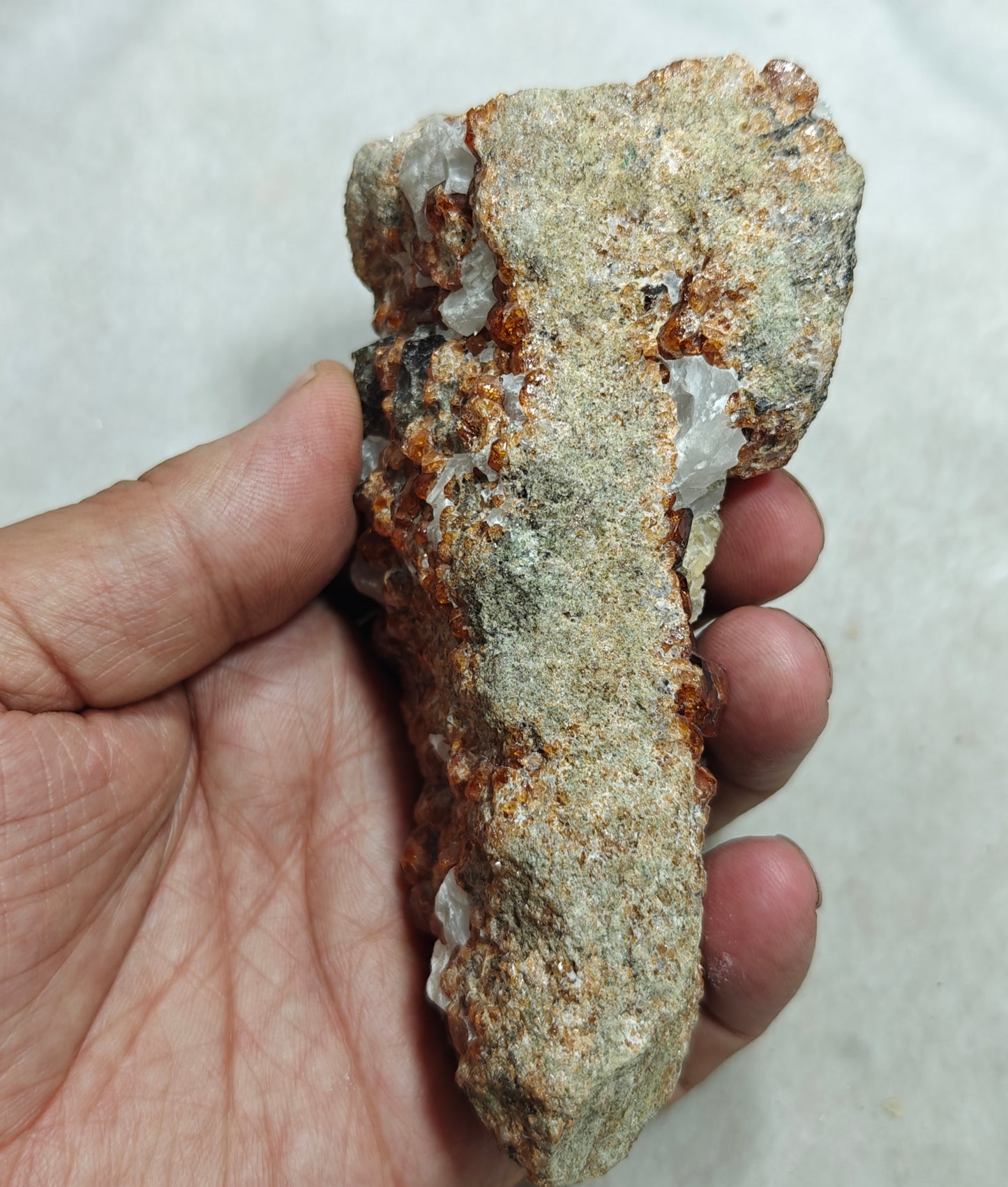 An aesthetic specimen of Garnet variety hessonite crystals on matrix 436 grams