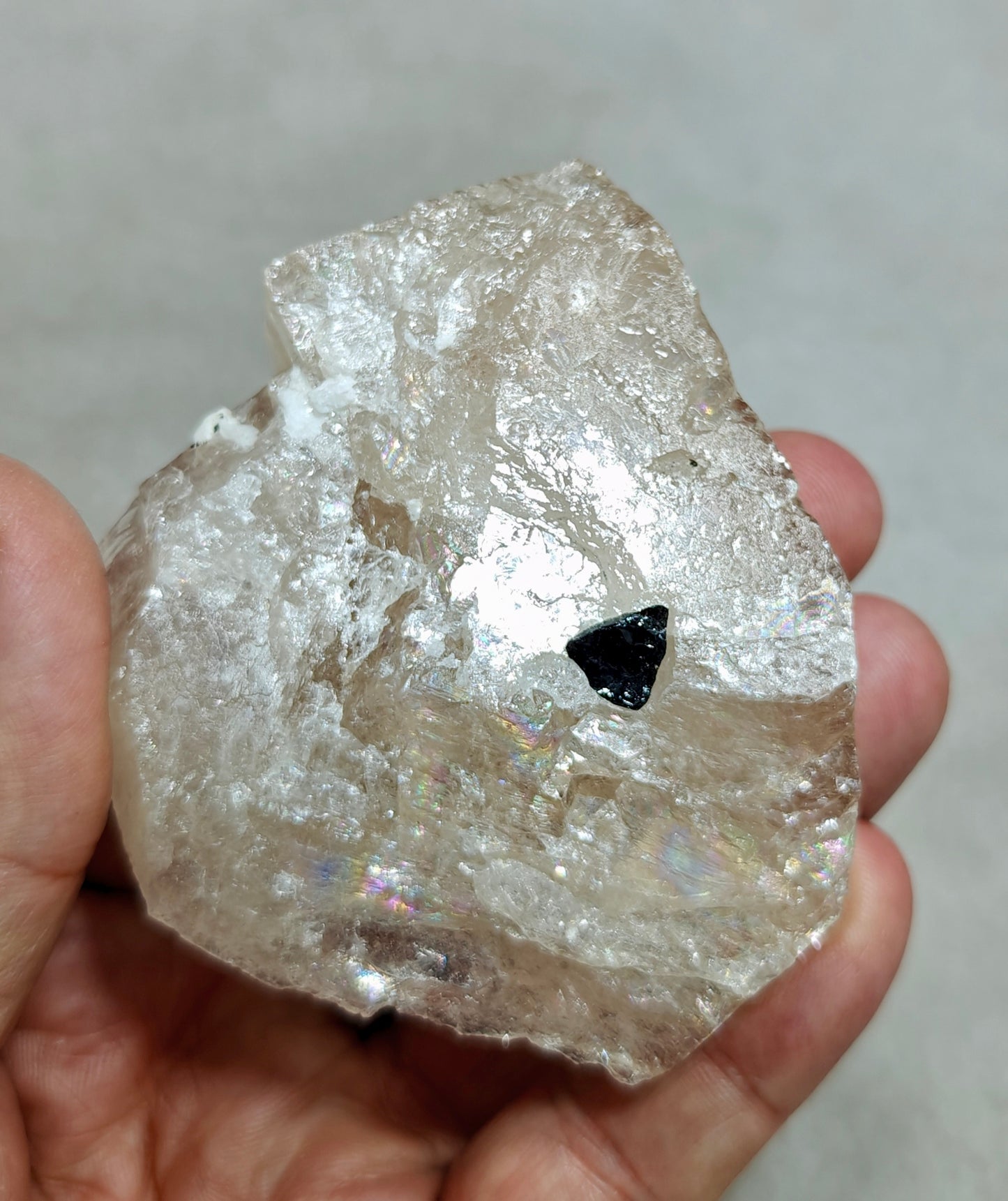 Natural light peach color Topaz crystal with rainbow effects with associated tourmaline 200 grams
