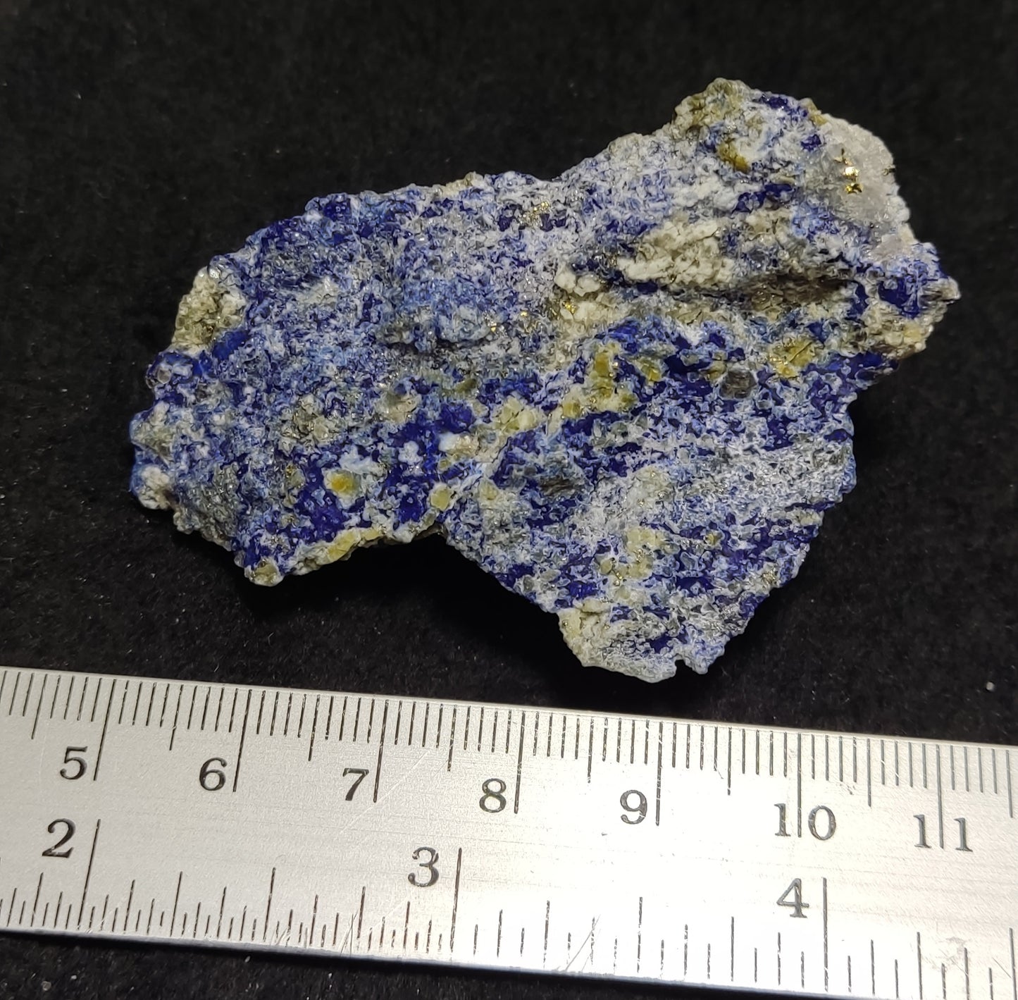 Partly Fluorescent natural lazurite with Pyrite 47 grams