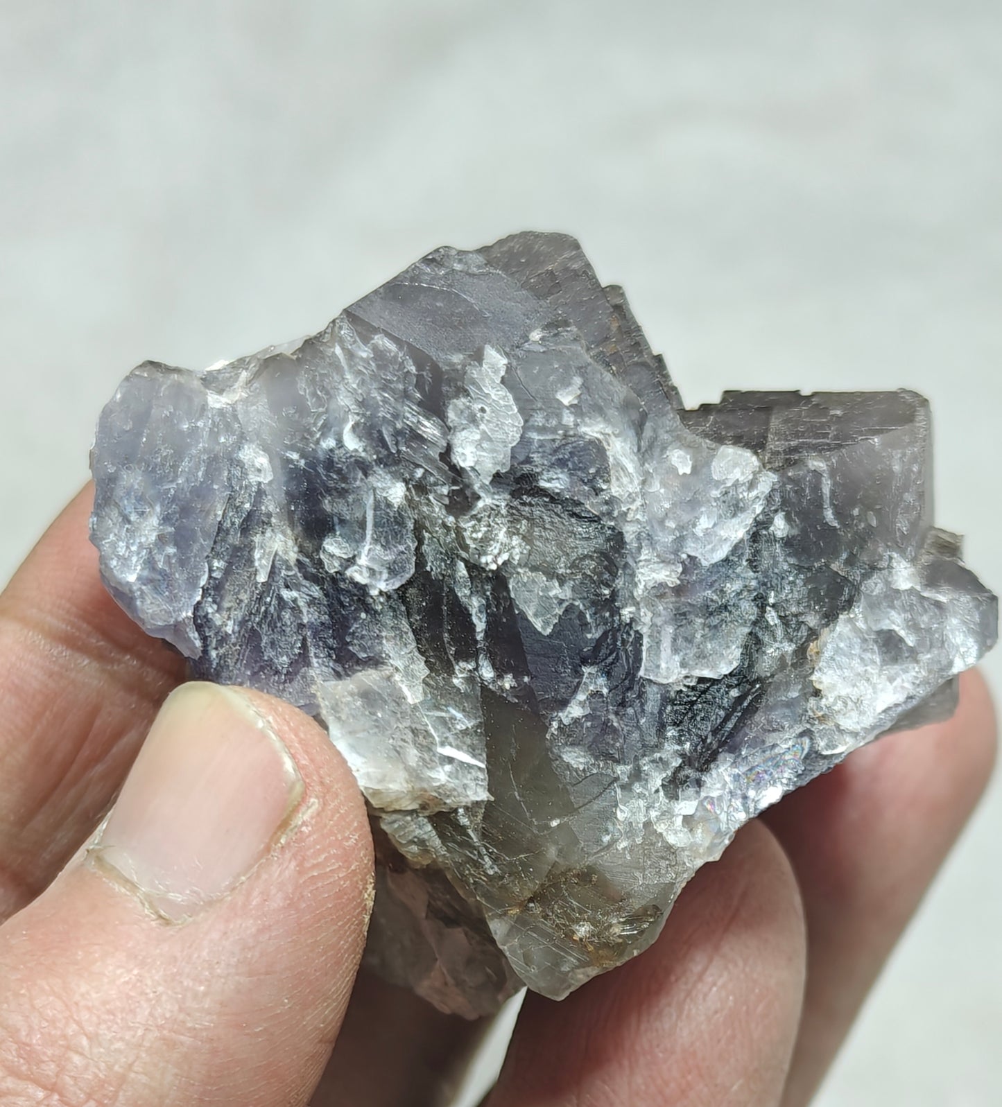 An amazing Single beautiful specimen of grey/purple fluorite with calcite crystals 150 grams