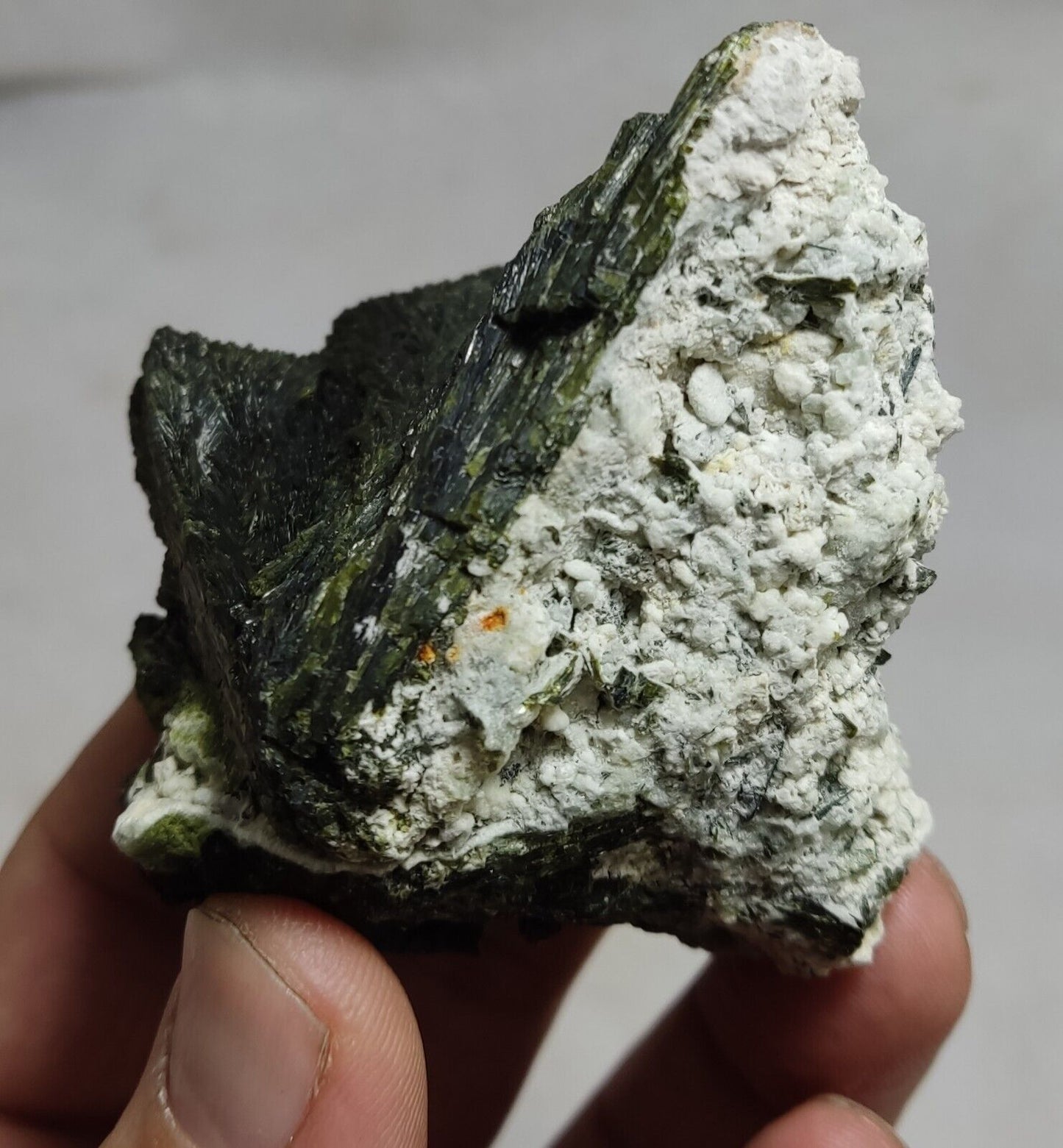 An aesthetic specimen of epidote crystal spray type on matrix 182 grams