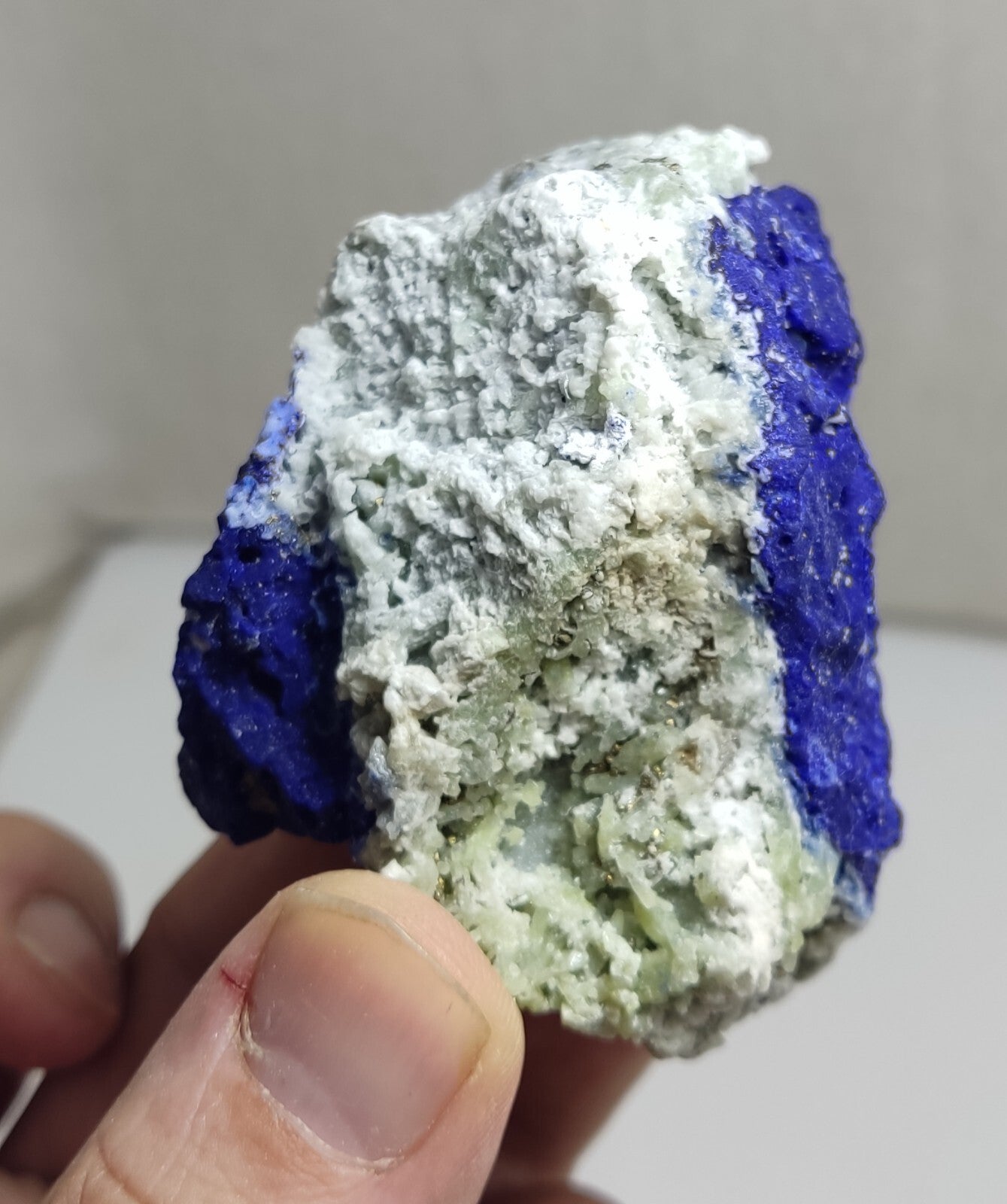 An Aesthetic specimen of fluorescent Lazurite with pyrite 181 grams