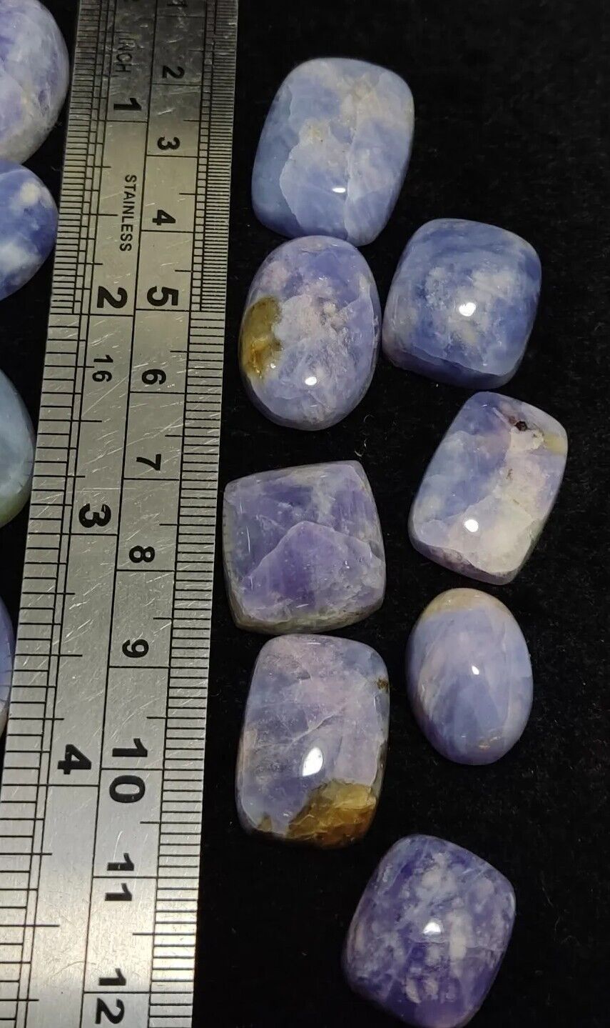 17 pieces Hackmanite cabochons fluorescent collective weight 350 carats