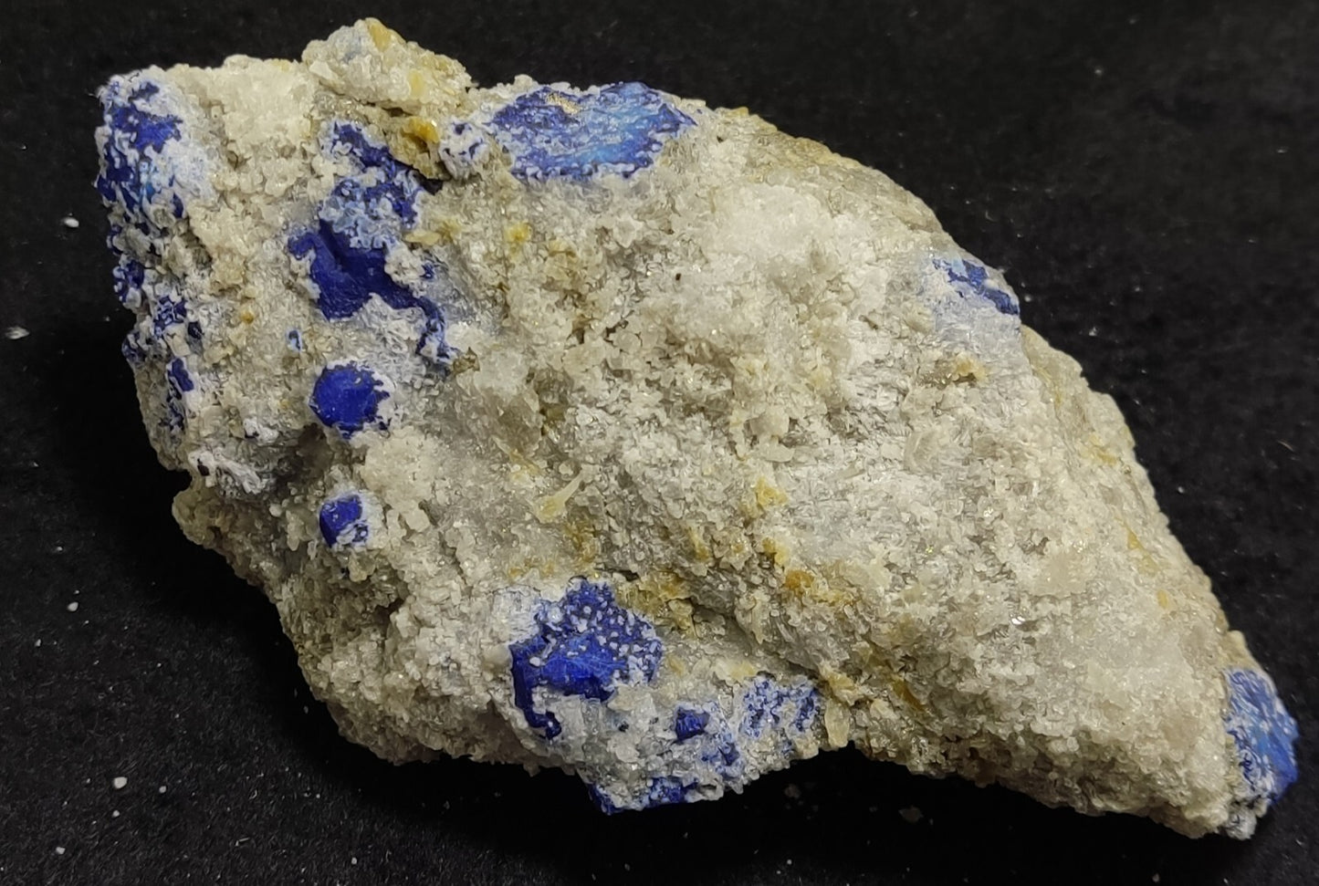 An Aesthetic specimen of fluorescent Lazurite with pyrite 415 grams