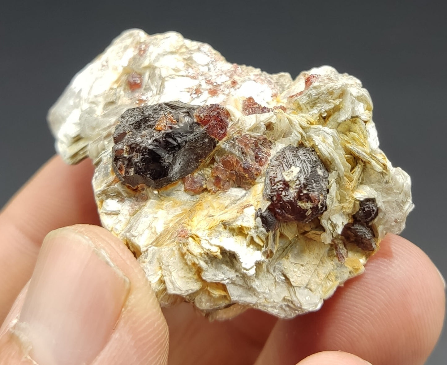 An aesthetic specimen of spessartine garnets on muscovite 36 grams