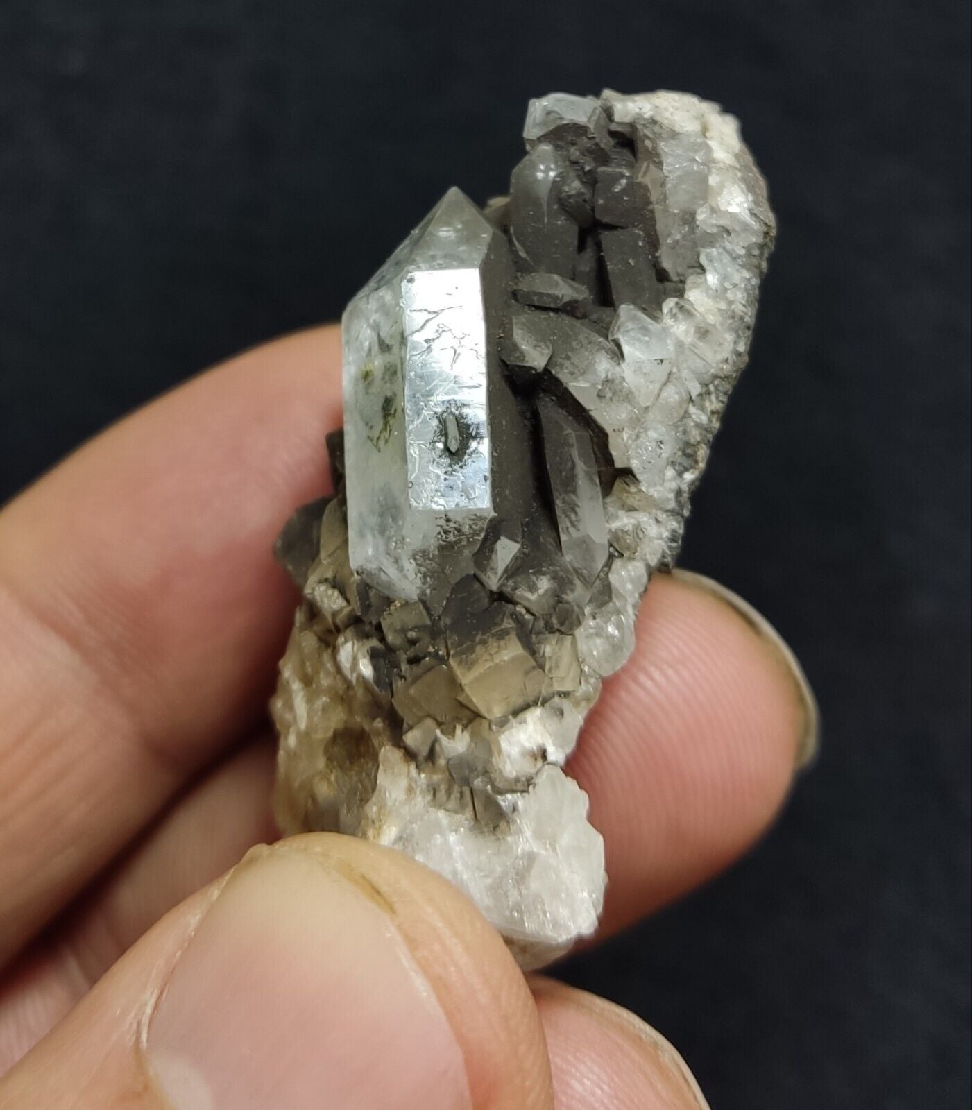 An Aesthetic quartz/calcite crystal specimen with petroleum inclusions 23 grams