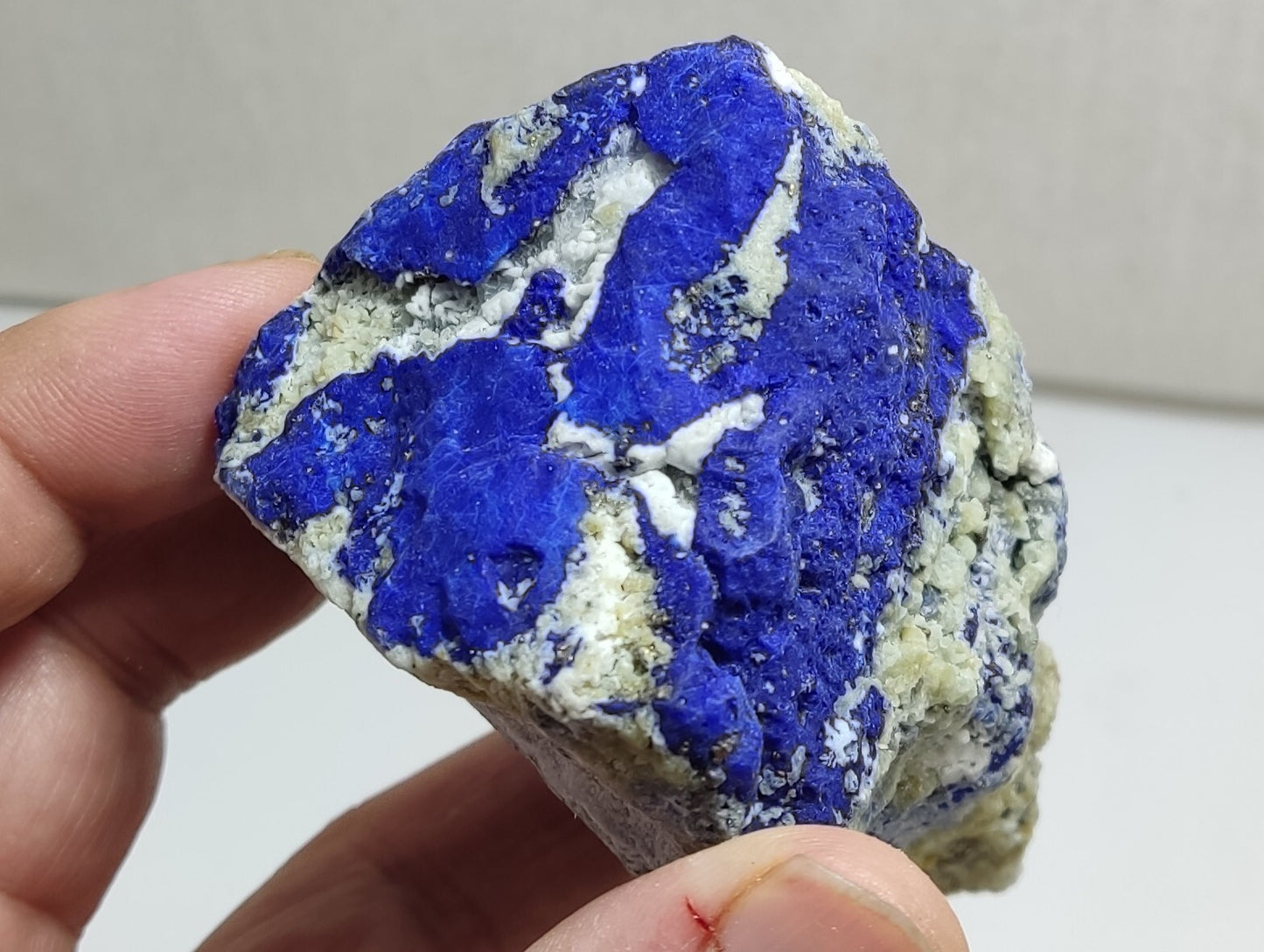 An Aesthetic specimen of fluorescent Lazurite with Pyrite 296 grams