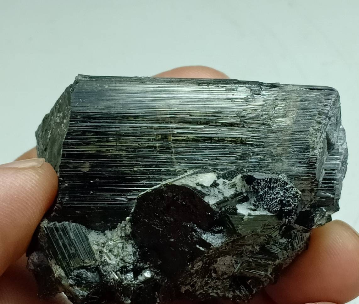 Single Tourmaline crystals cluster with Green color and chatoyant effects indicting cat's eye 150 grams