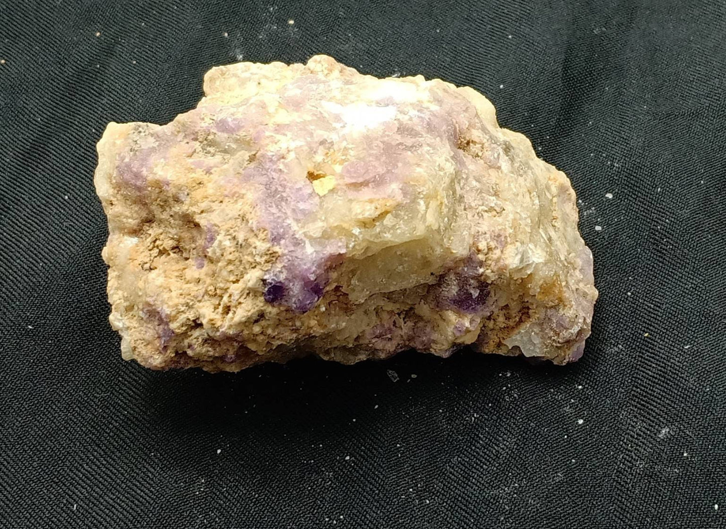 An amazing specimen of UV reactive tenebrescent Fluorescent Hackmanite Chunk with Richterite 147 grams