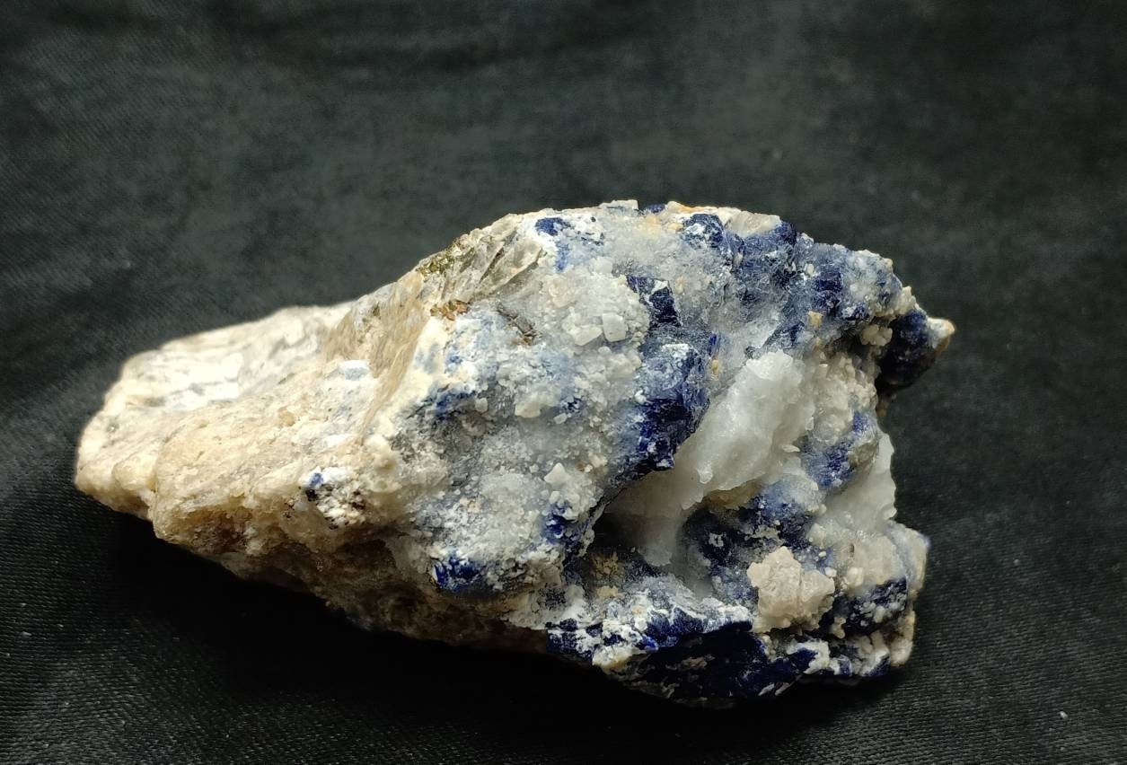 An Aesthetic Specimen of Sodalite Lapis on matrix partly Fluorescent 172 grams