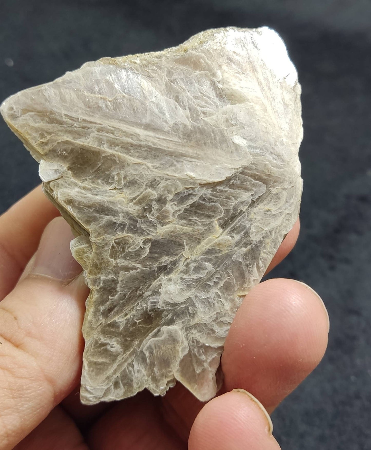 An amazing aesthetic specimen of spessartine garnet embedded in muscovite 56 grams