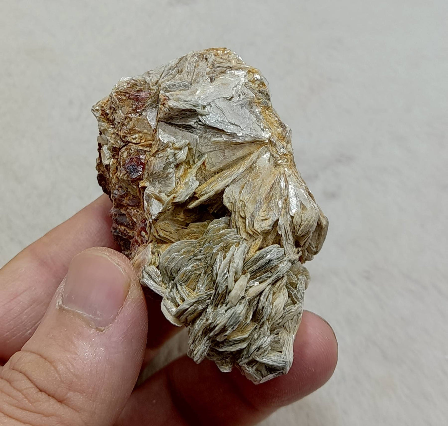 An amazing beautiful specimen of spessartine Garnet crystals on matrix with mica 135 grams