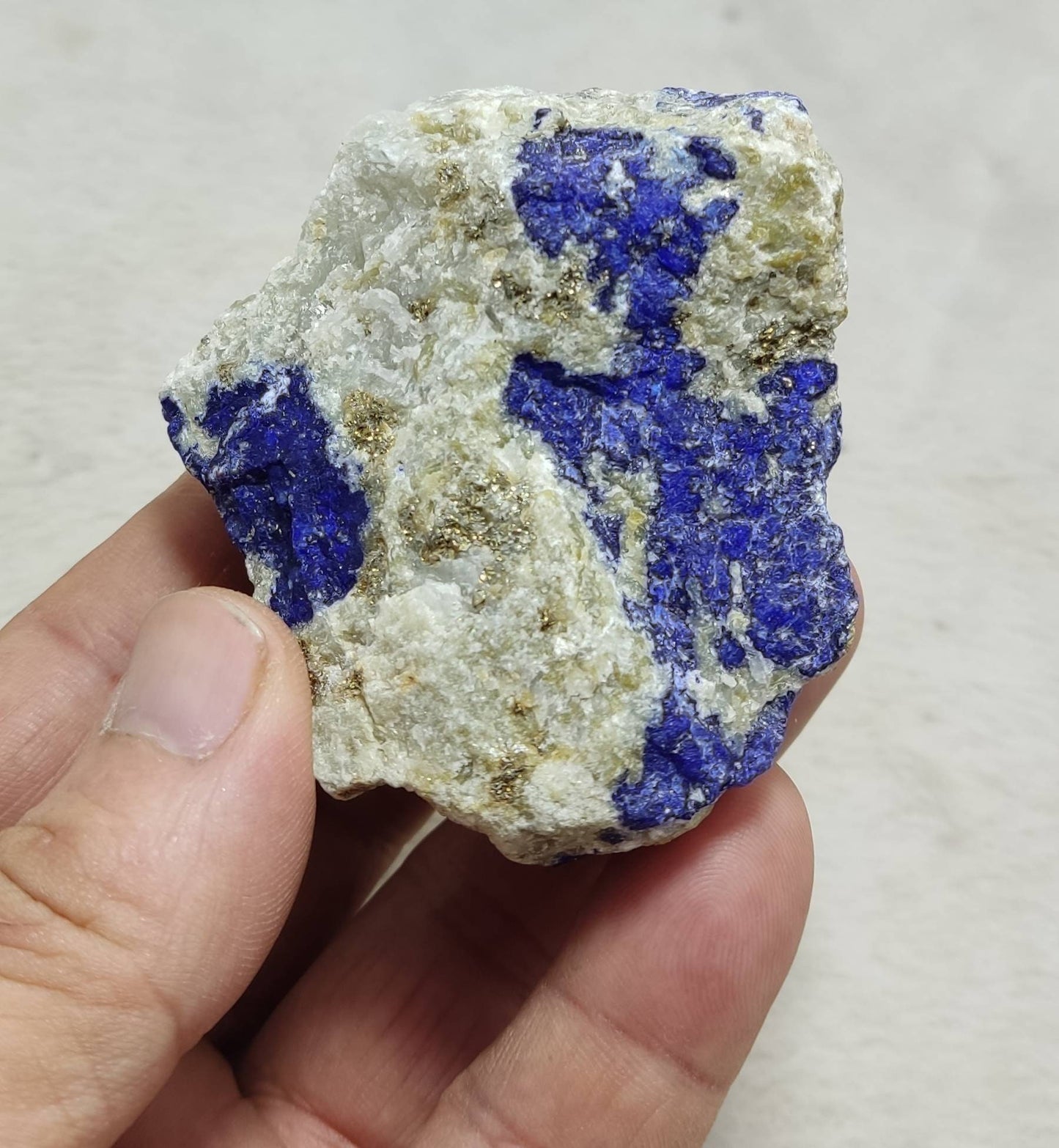 Amazing specimen of fluorescent Lazurite on matrix with pyrite 173 grams