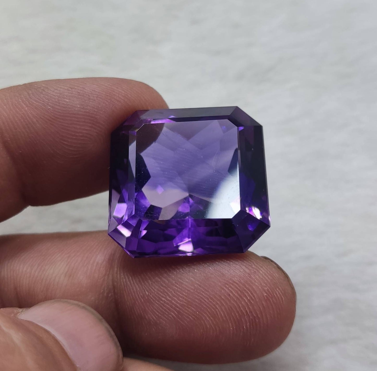 An amazing faceted octagon cut amethyst gemstone 64 carats