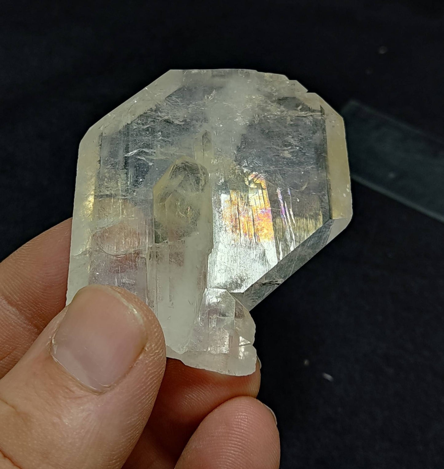 Clear faden quartz crystal with light iron coating 55 grams