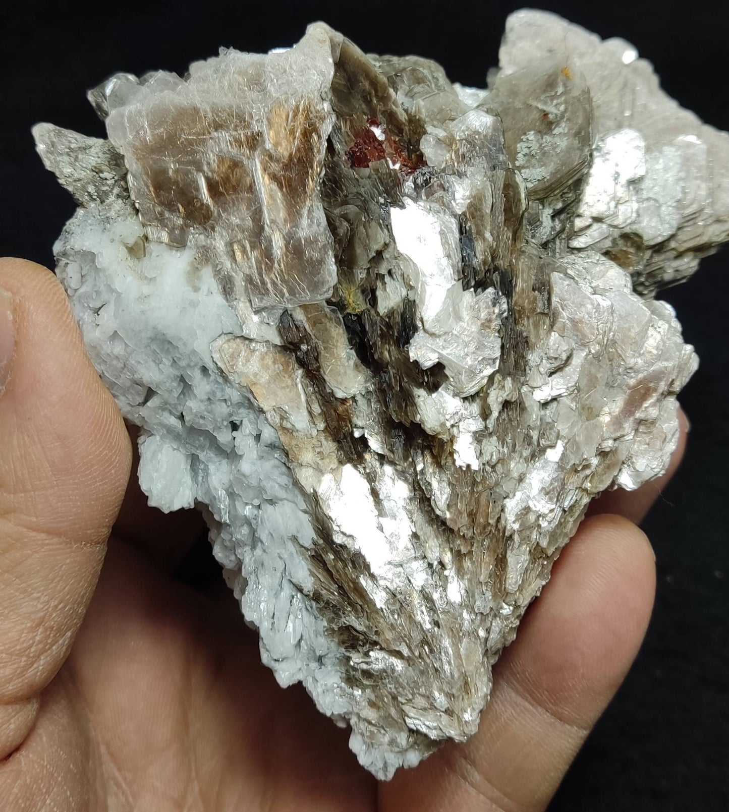 An amazing aesthetic specimen of spessartine garnet embedded in muscovite and albite 433 grams