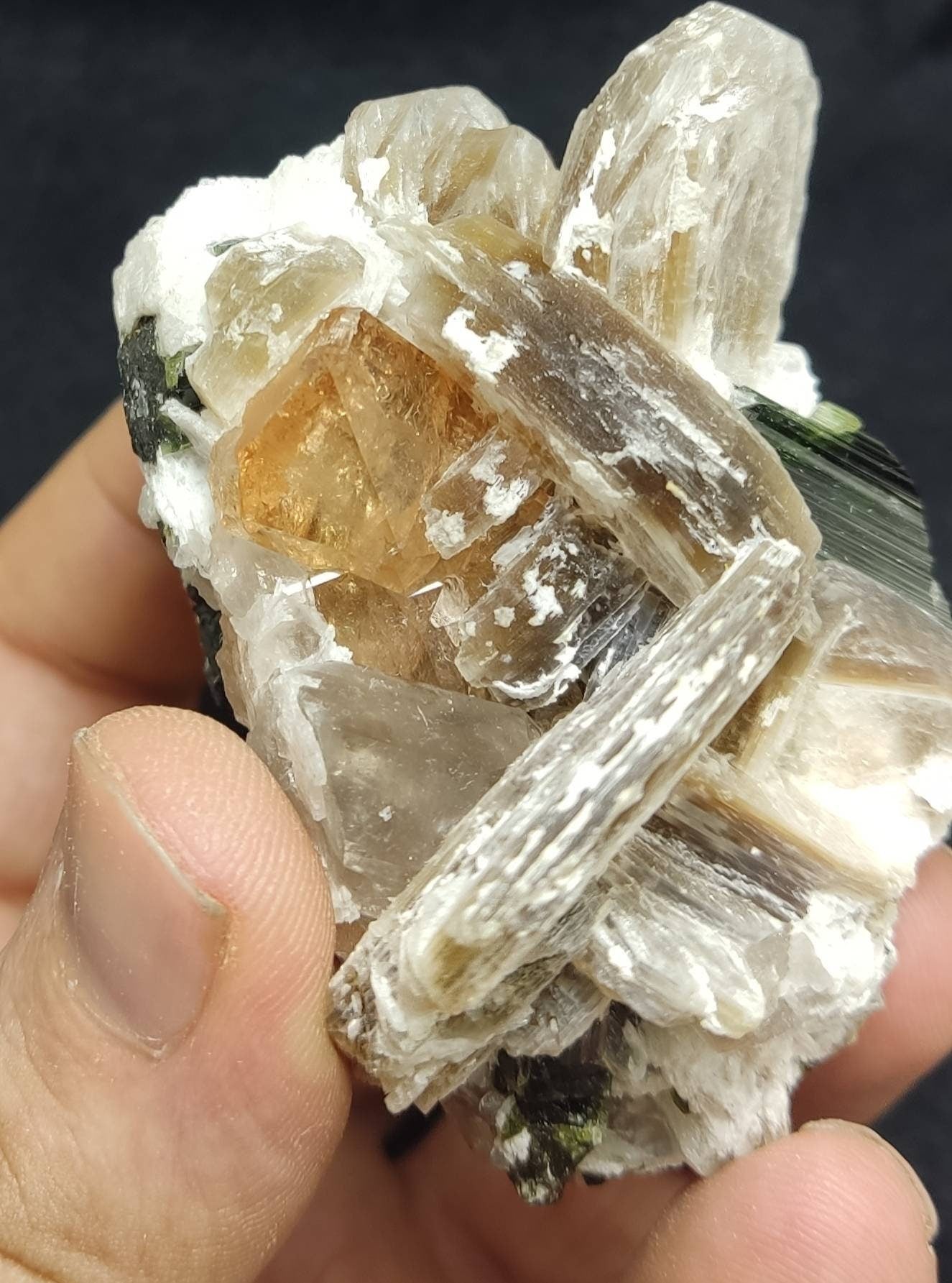 An amazing Specimen of terminated peach color Topaz crystals with quartz and tourmaline 210 grams