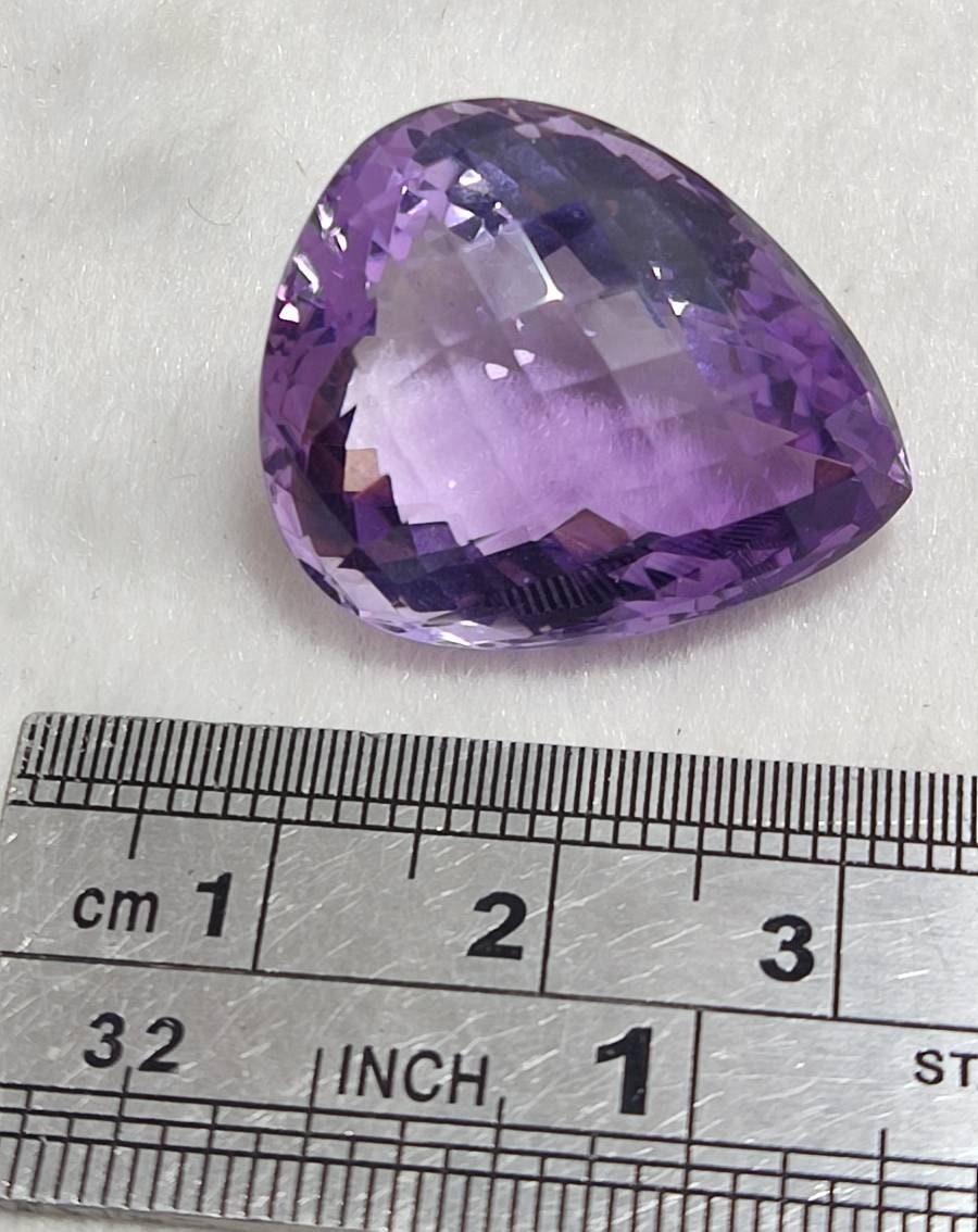 Tear drop cut faceted amethyst gemstone 40 carats