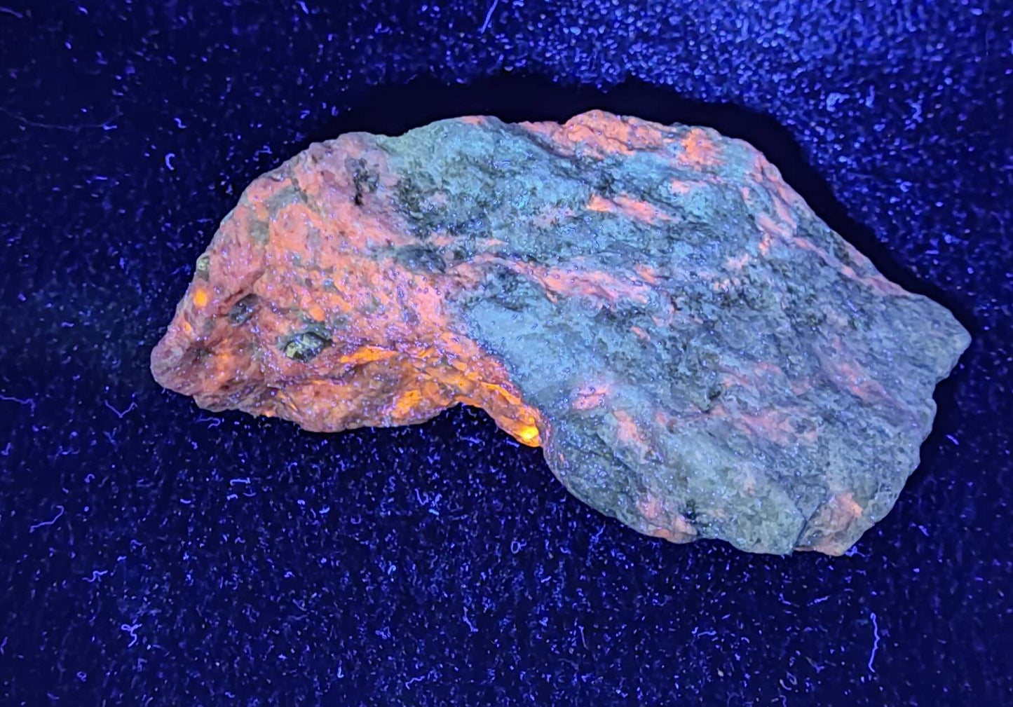 An amazing specimen of fluorescent hackmanite in matrix 653 grams