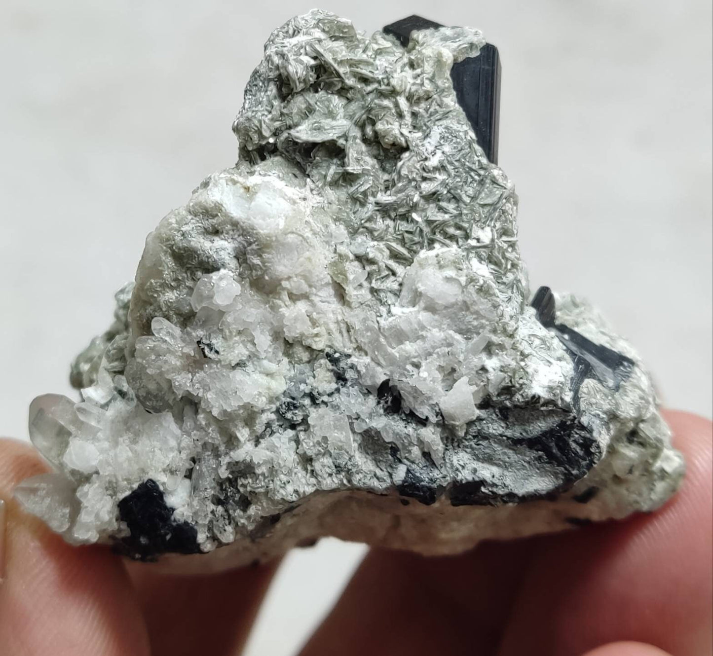 Black tourmaline specimen with feldspar and muscovite 83 grams