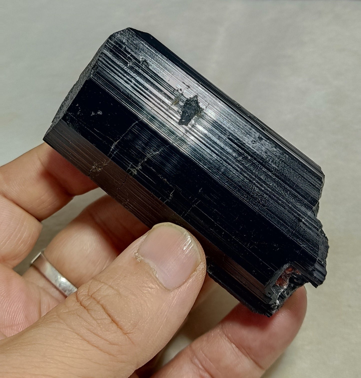 Natural black Tourmaline crystal with spessartine garnet inclusions 245 grams