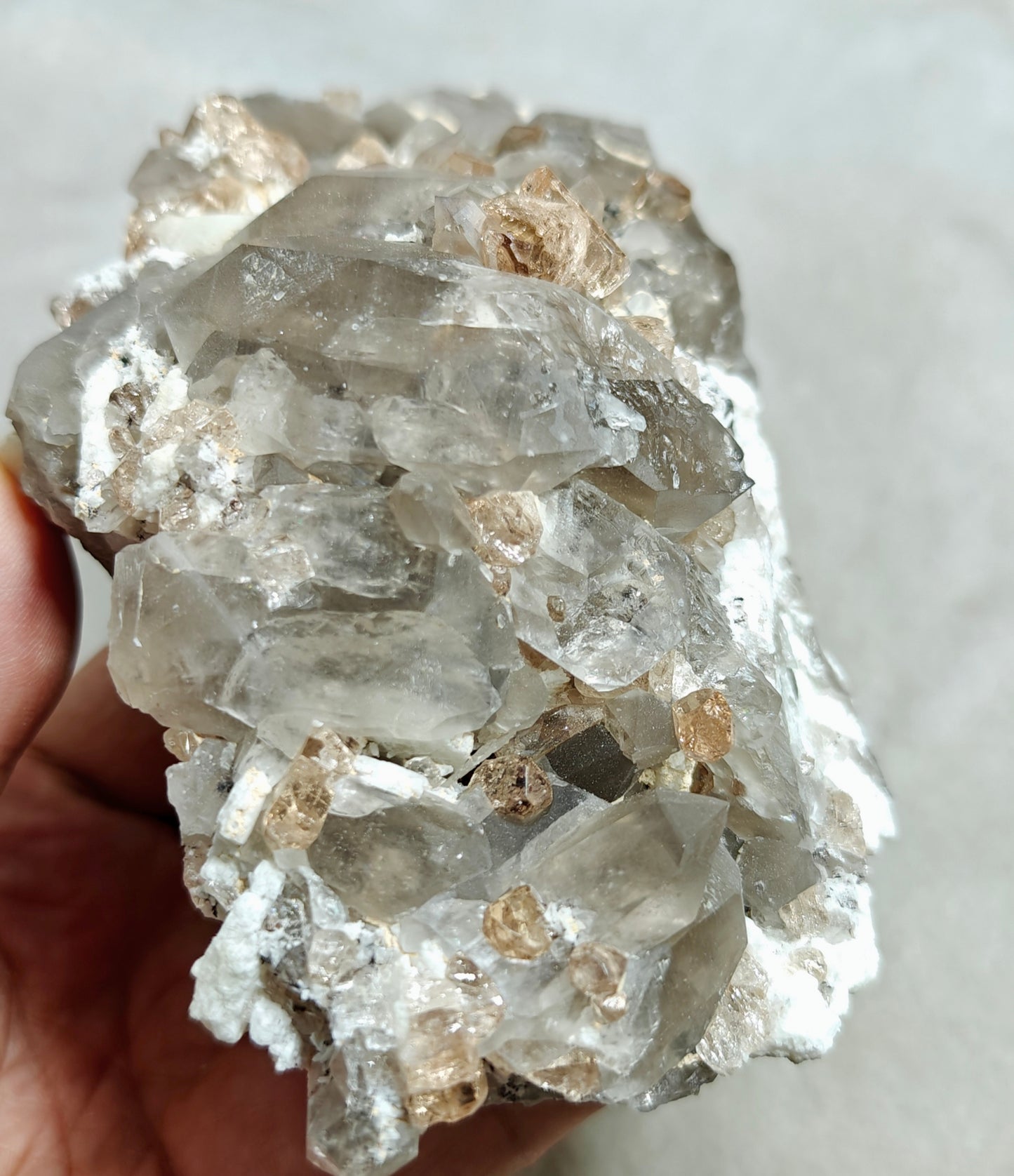 Natural terminated peach color Topaz crystals with smoky quartz on matrix 750 grams