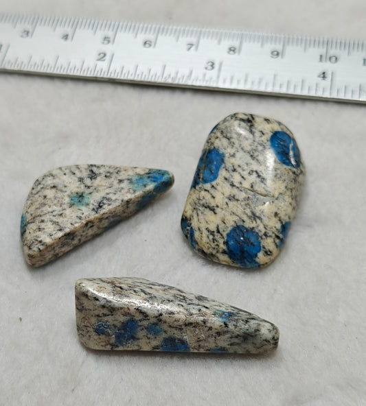 3 Natural K2 stone tumbles also known as Azurite in granite