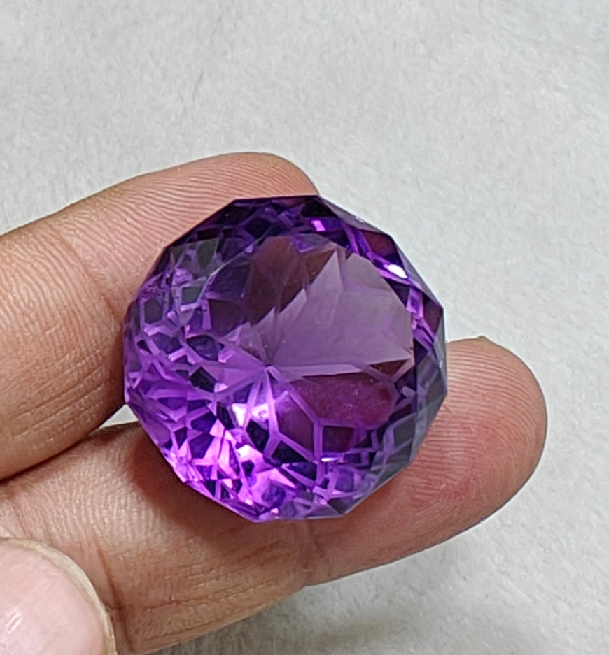 An amazing faceted fancy cut amethyst gemstone 77 carats