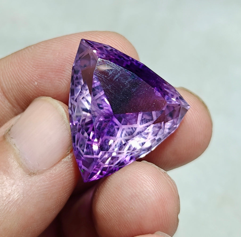 An amazing trillion fancy cut faceted amethyst gemstone 46 carats