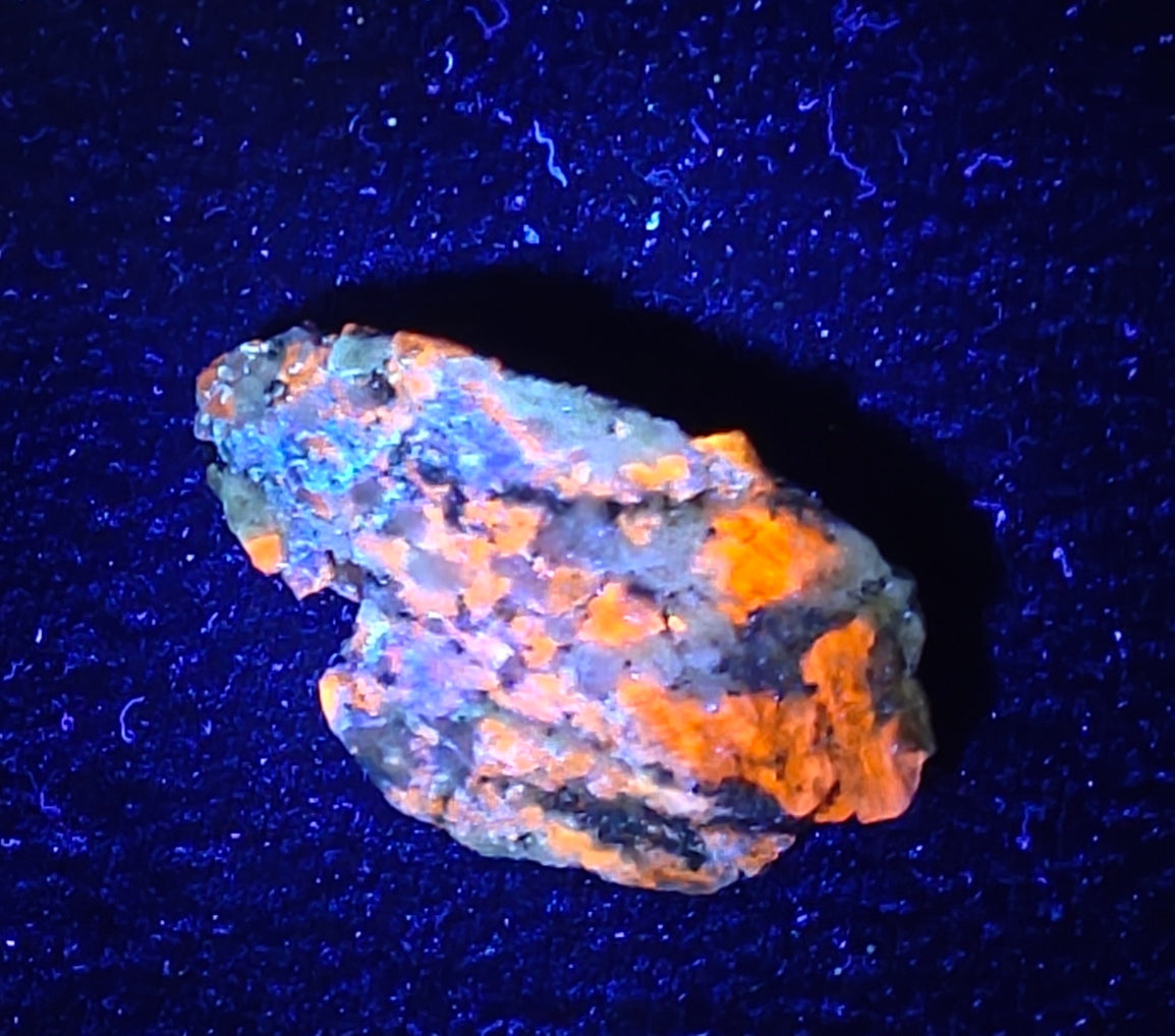 Afghanite Fluorescent in matrix with some pyrite and phlogopite 41 grams