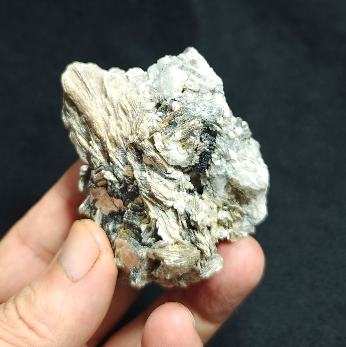 Natural spessartine garnet embedded in muscovite, with albite 150 grams