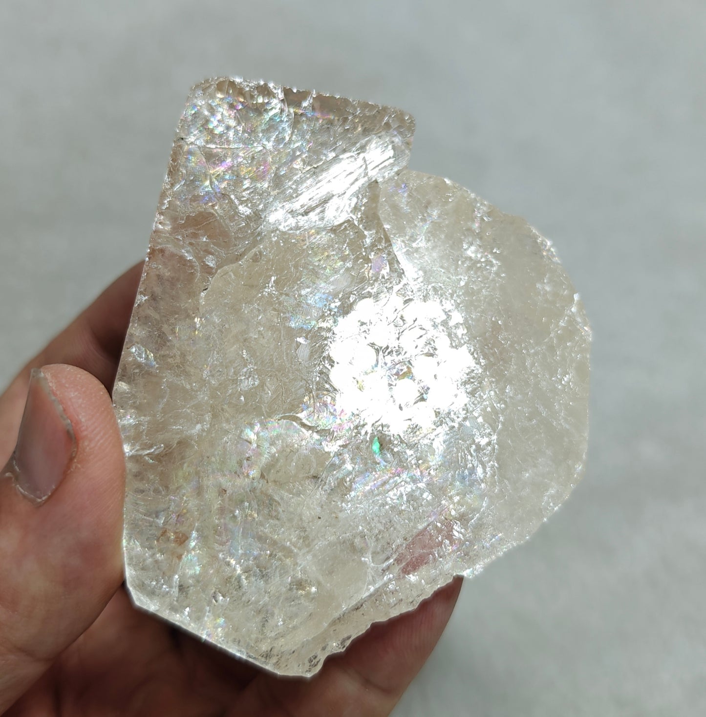Natural light peach color Topaz crystal with rainbow effects with associated tourmaline 200 grams