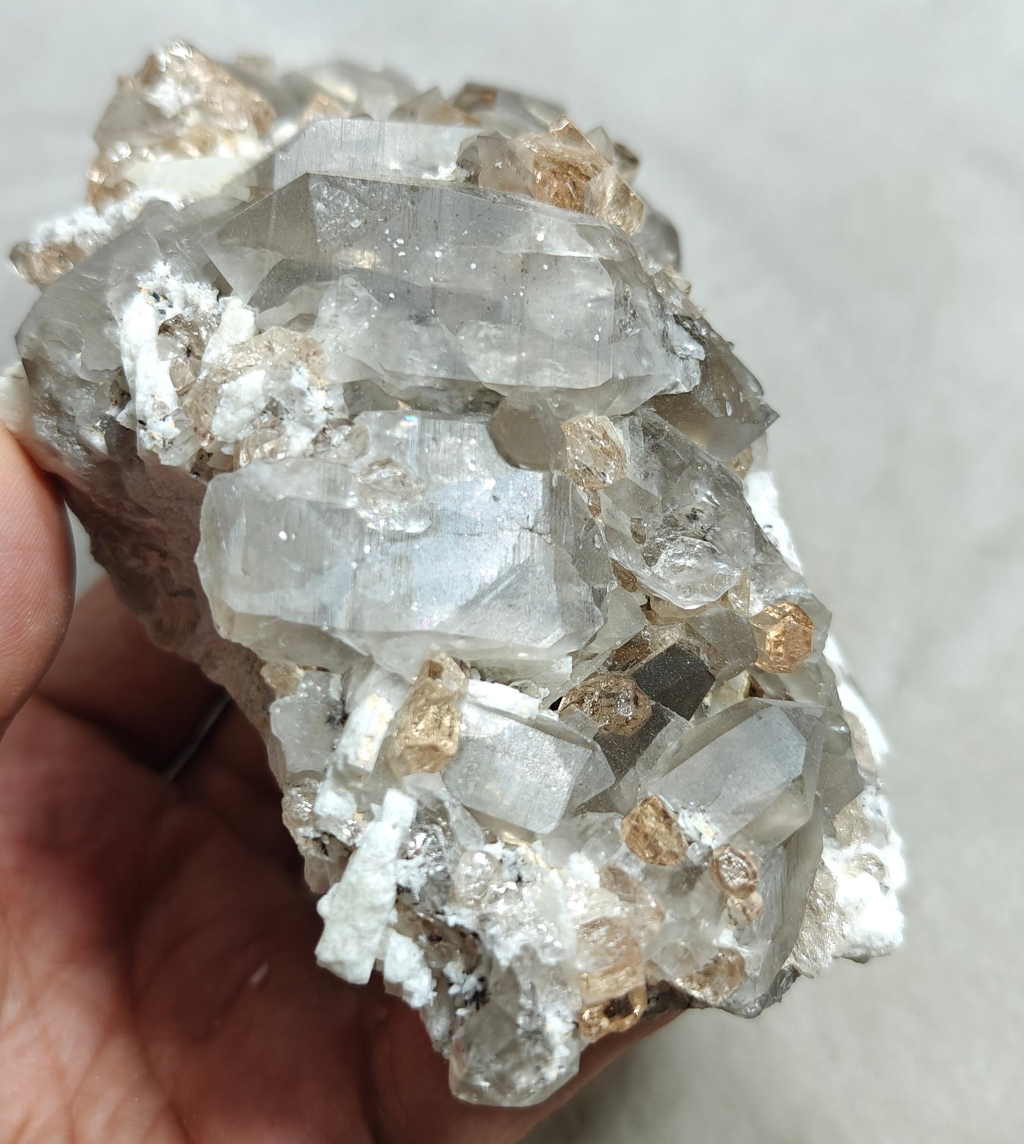 Natural terminated peach color Topaz crystals with smoky quartz on matrix 750 grams