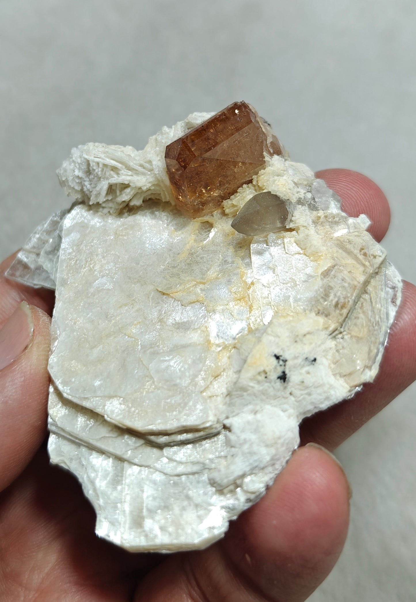 peach color Topaz crystal embedded in muscovite 48 grams
