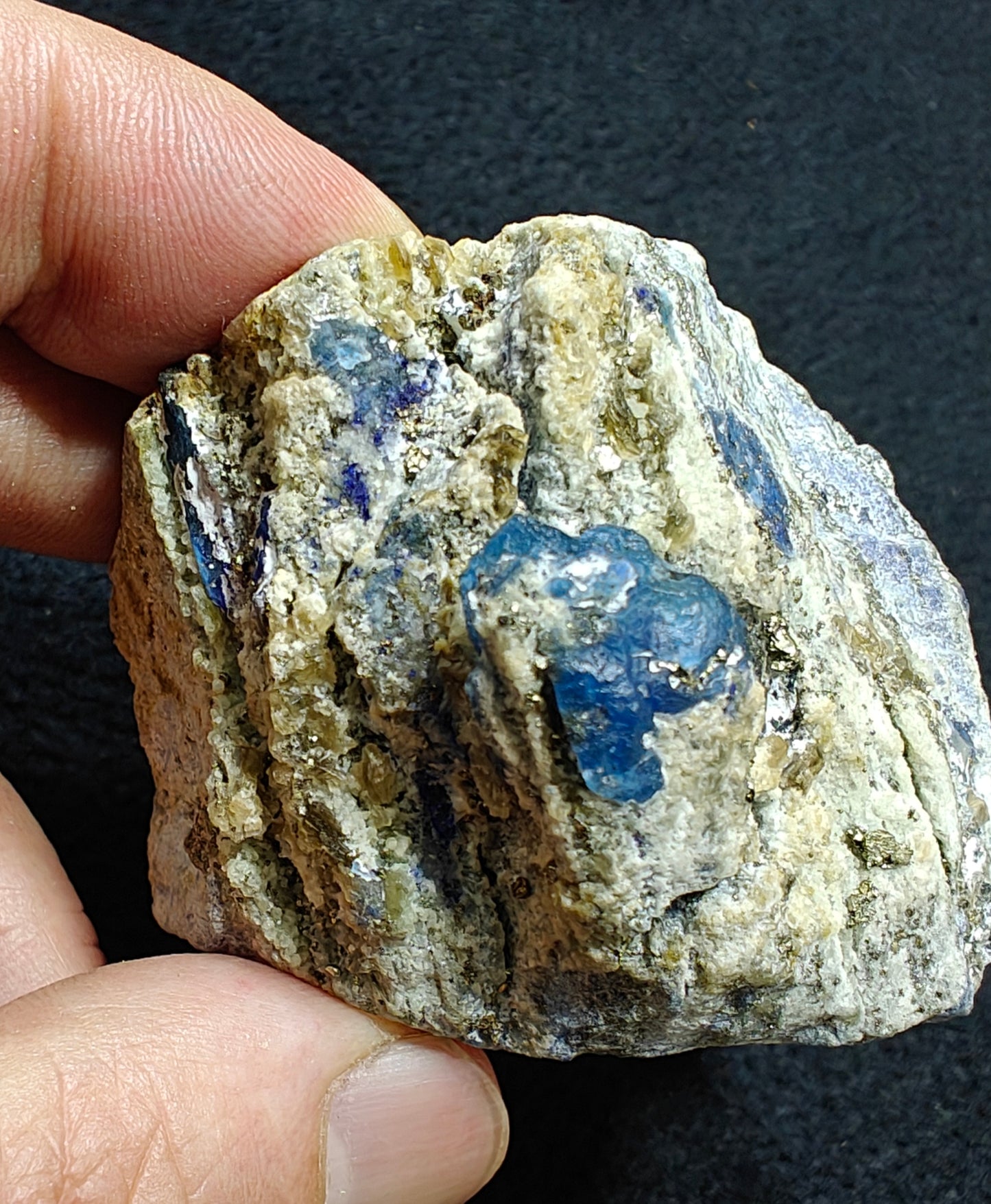 Afghanite Fluorescent in matrix with some pyrite 190 grams