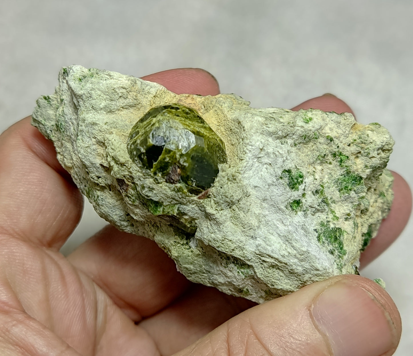 An Aesthetic specimen of garnet variety demantoid crystal On Matrix 140  grams