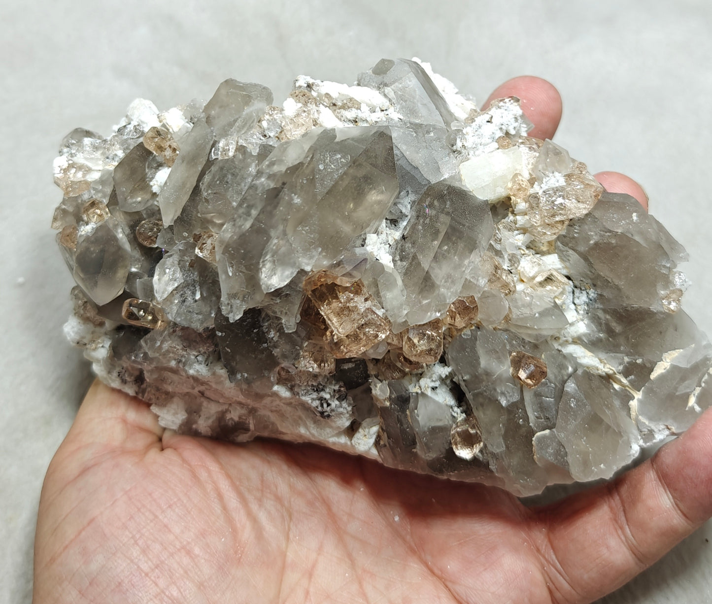 Natural terminated peach color Topaz crystals with smoky quartz on matrix 750 grams