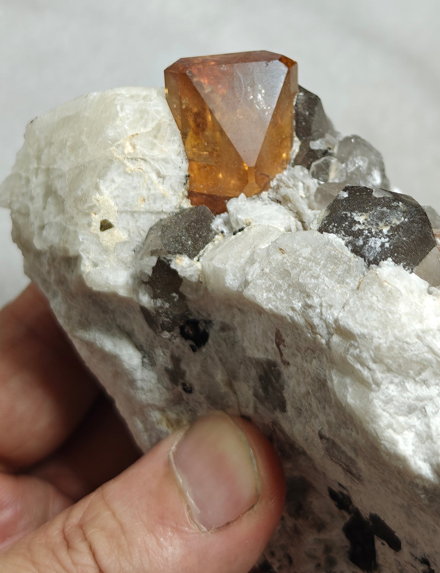 Terminated peach color Topaz crystal on matrix 576 grams