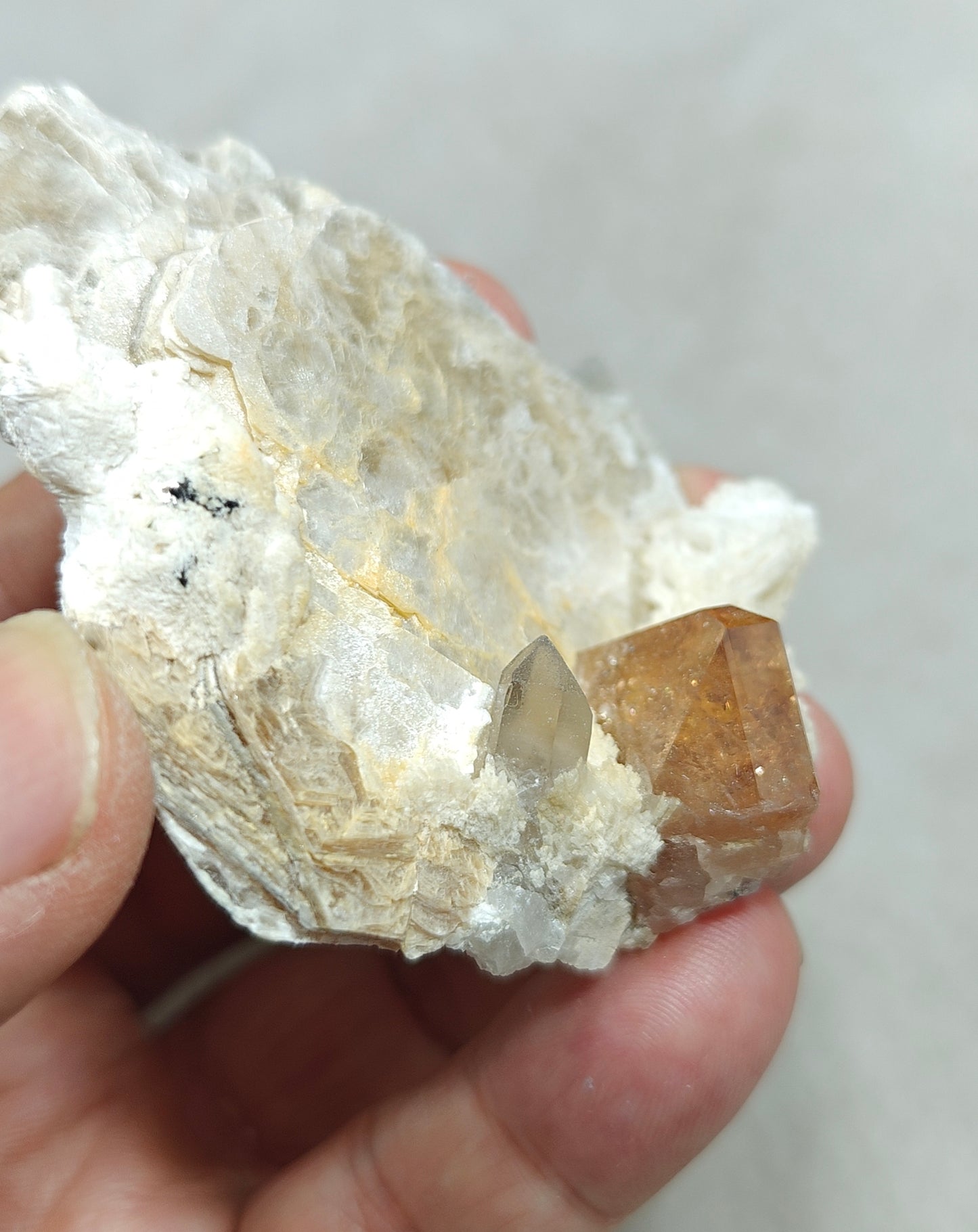 peach color Topaz crystal embedded in muscovite 48 grams