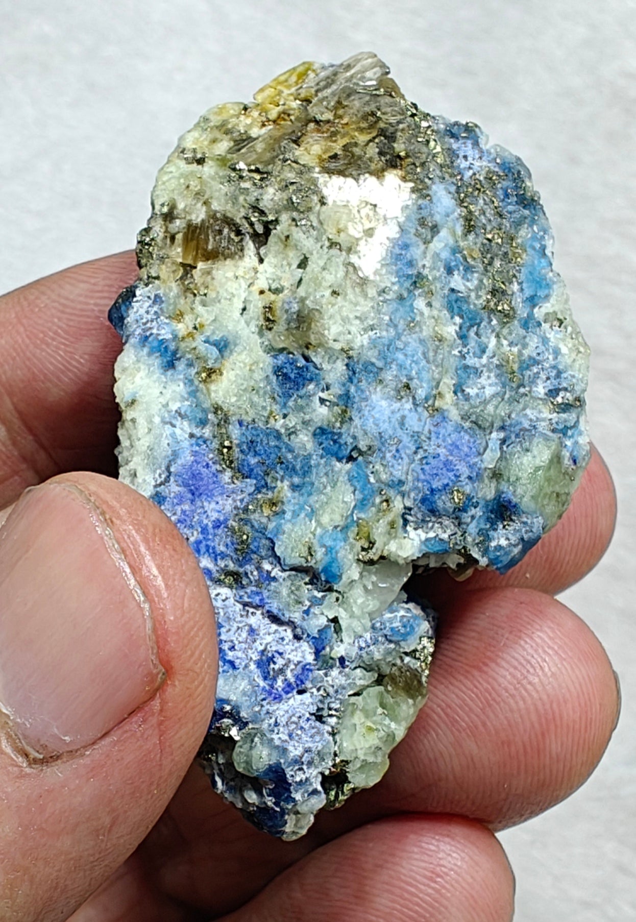 Afghanite Fluorescent in matrix with some pyrite and phlogopite 41 grams