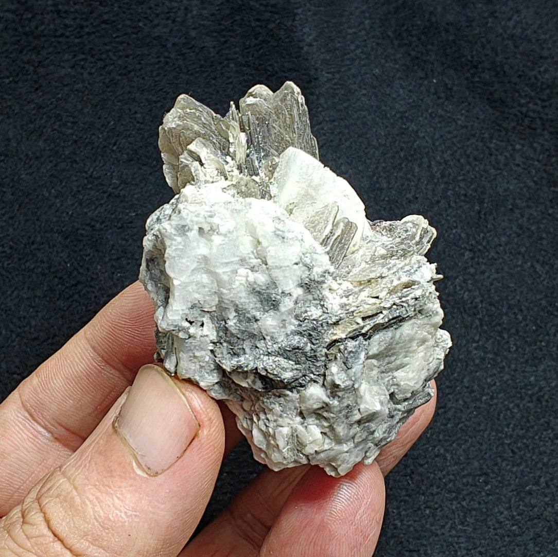 Natural spessartine garnet embedded in muscovite, with albite 150 grams