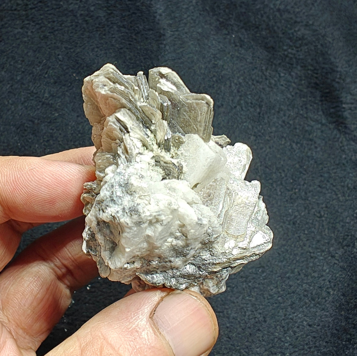 Natural spessartine garnet embedded in muscovite, with albite 150 grams