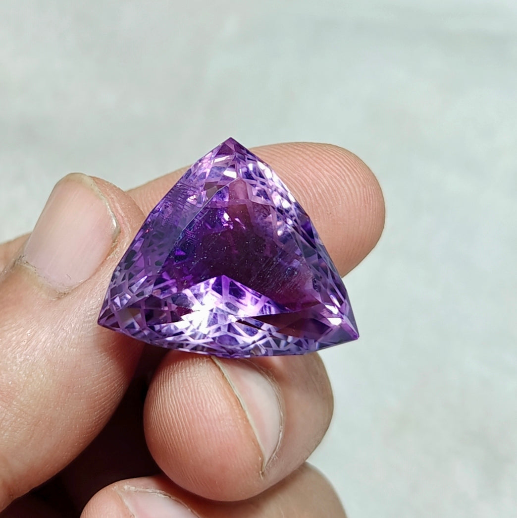 An amazing trillion fancy cut faceted amethyst gemstone 46 carats