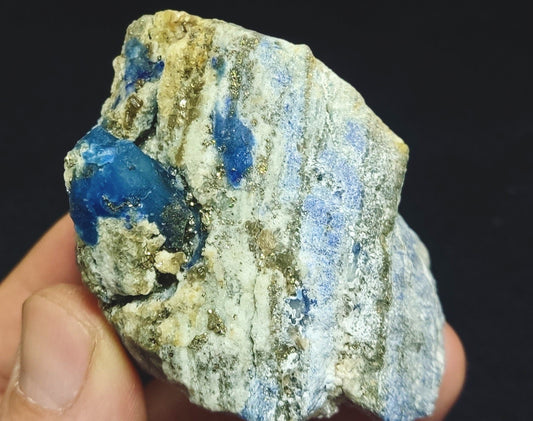 Afghanite Fluorescent in matrix with some pyrite 190 grams