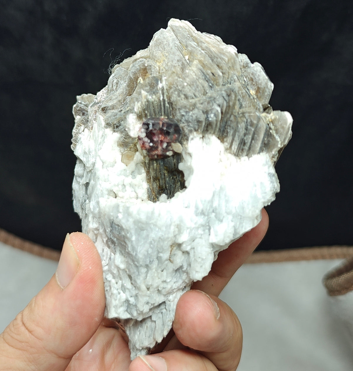 Natural spessartine garnet embedded in muscovite and albite 433 grams