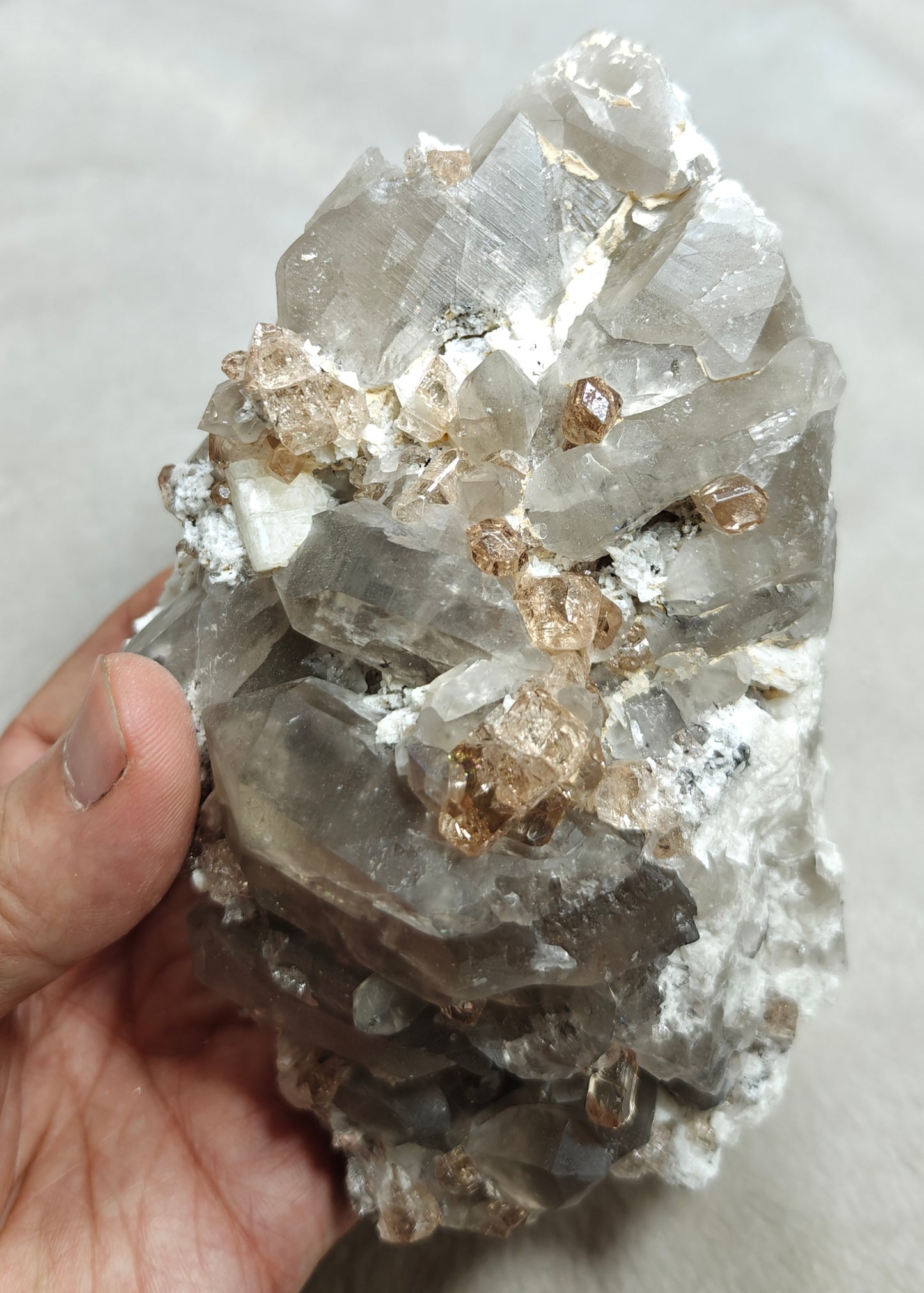 Natural terminated peach color Topaz crystals with smoky quartz on matrix 750 grams