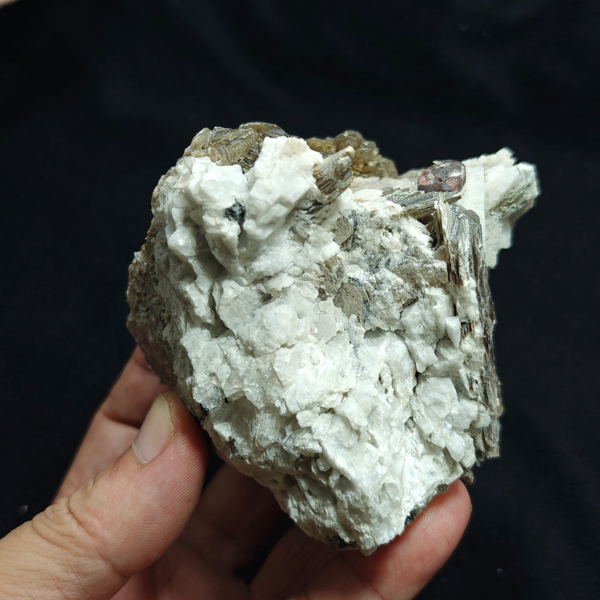 Natural spessartine garnet embedded in muscovite, with albite and quartz 544 grams